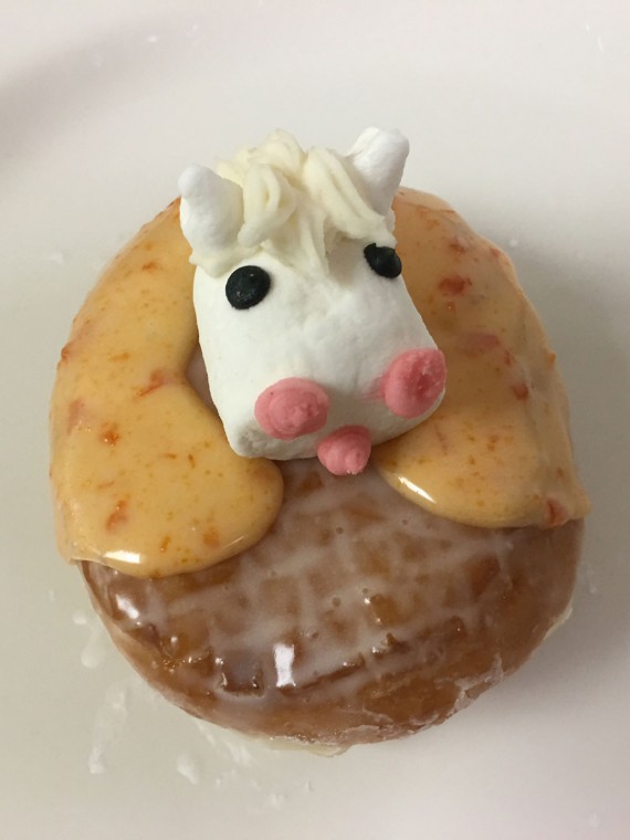 Horse-in-Shoe-donut.-It-is-a-raised-donut-filled-with-jelly-with-a-decorated-horseshoe-and-decorated-marshmallow-horse-head-on-top