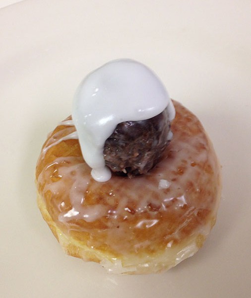 Pikes-Peak-donut.-It-is-a-glazed-chocolate-crueller-with-two-donut-balls-and-extra-icing